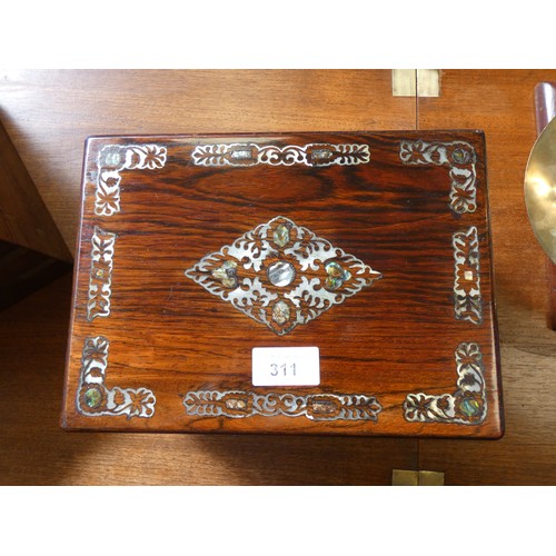 311 - A mother of pearl inlaid rosewood fitted toilet case, 10