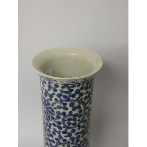 155 - A 19th century Chinese cylindrical vase with blue and white painted floral decoration  26cms tall, f... 