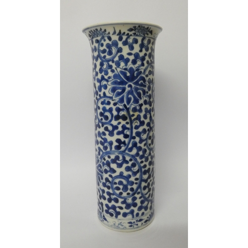 155 - A 19th century Chinese cylindrical vase with blue and white painted floral decoration  26cms tall, f... 