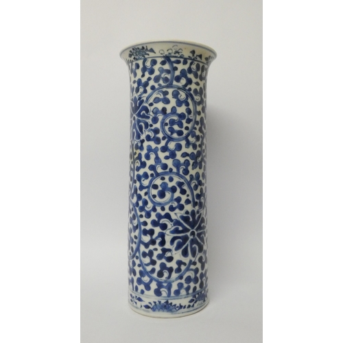 155 - A 19th century Chinese cylindrical vase with blue and white painted floral decoration  26cms tall, f... 