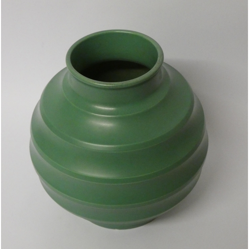 160 - Keith Murray for Wedgwood, a green glazed banded globular vase, 18cm high