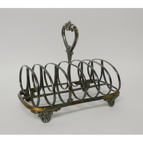 500 - A Victorian silver toast rack, London 1861 - John Evans. 17cms across, 8.1 troy ounces