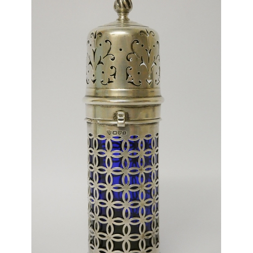 502 - Edwardian silver sugar caster, the cylindrical pierced body with blue glass liner, Haseler Brothers,... 