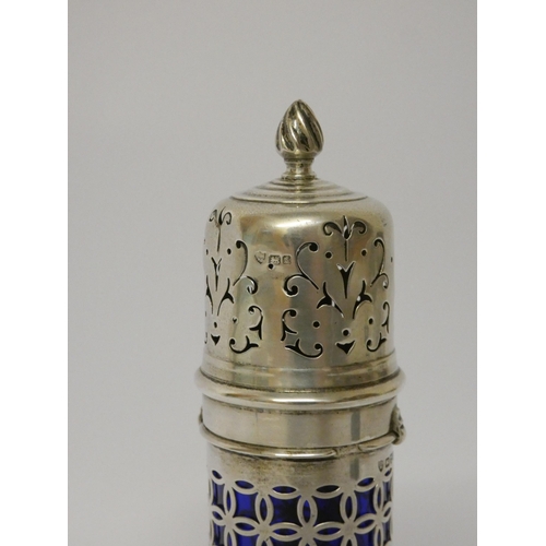 502 - Edwardian silver sugar caster, the cylindrical pierced body with blue glass liner, Haseler Brothers,... 