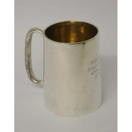 504 - A modern silver Christening tankard, of plain form, with inscription dated 1943. Birmingham marks. W... 