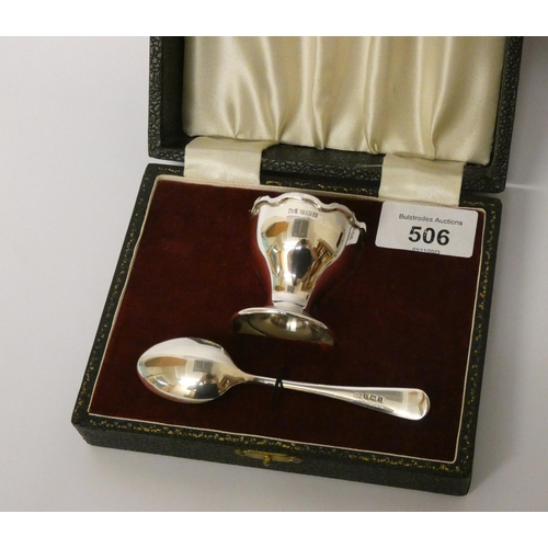 506 - A modern silver egg cup and spoon, non-engraved, in fitted case.