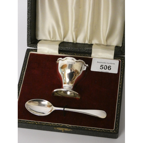 506 - A modern silver egg cup and spoon, non-engraved, in fitted case.