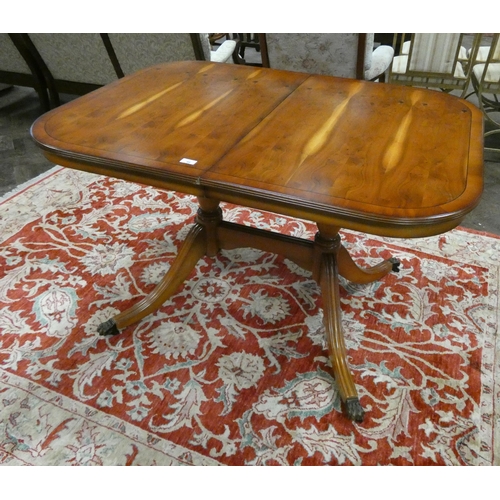 46 - A Georgian style yew wood extending dining table with cross banded top and centre leaf, 4' x 3'