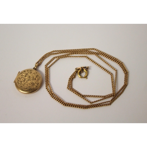 424 - A circular 9ct gold locket on long gold chain. Gross weight 9.4g