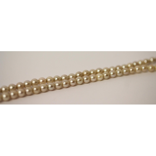 440 - A vintage row of graduated cultured pearls, with amethyst set 9ct rose gold clasp. In old leather bo... 