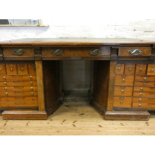 68 - An early 20th century Shannon File Company Limited oak pedestal desk with fold away index cabinet pe... 