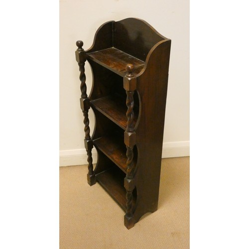 70 - A small four tier oak open bookcase with barley twist columns, 17