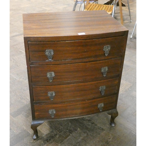 90 - A  mahogany bow front chest of four long drawers standing on cabriole feet, 2' wide