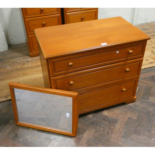 128 - A modern Stag teak chest of three long drawers with a freestanding hanging mirror