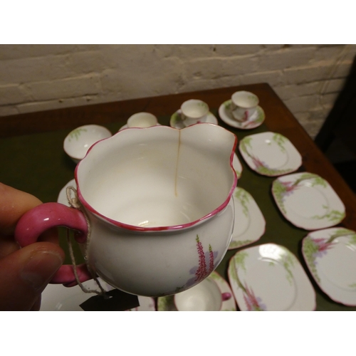 105 - A Royal Albert Foxglove pattern bone china tea set of 22 pieces - milk jug has a small crack