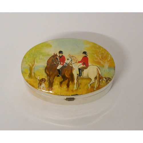 524 - A hallmarked silver oval snuff box, the hinged lid hand painted with hunting scene. 8cms across appr... 