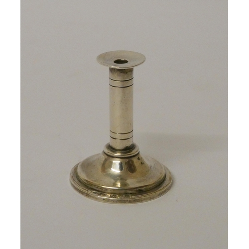 529 - Asprey - a miniature silver candlestick. 4cms high, London 1911.