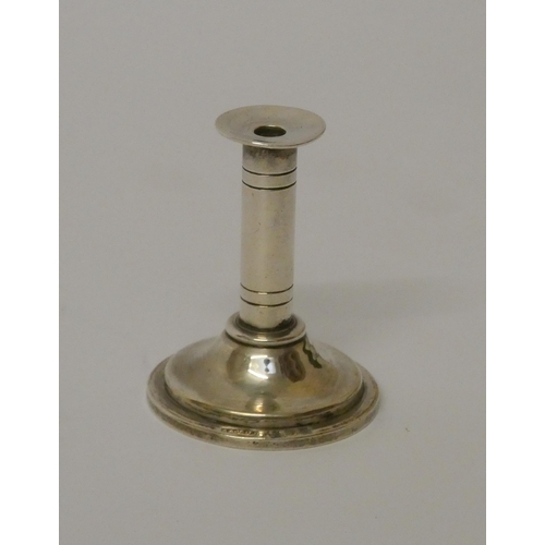 529 - Asprey - a miniature silver candlestick. 4cms high, London 1911.