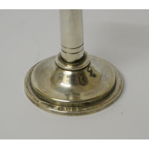 529 - Asprey - a miniature silver candlestick. 4cms high, London 1911.