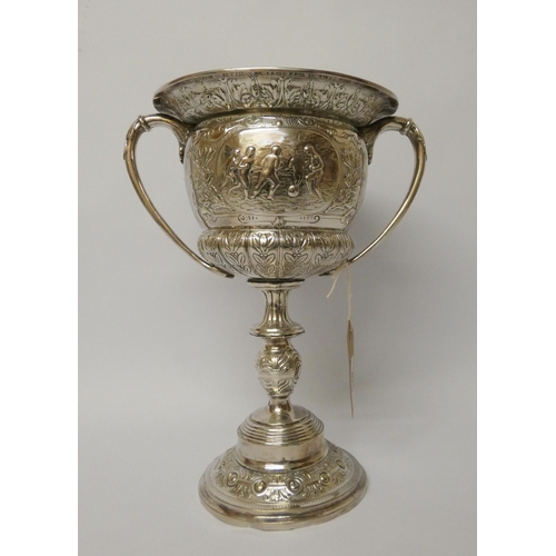 530 - A large silver plated twin handled trophy cup - The Carter Cup. 28cms tall