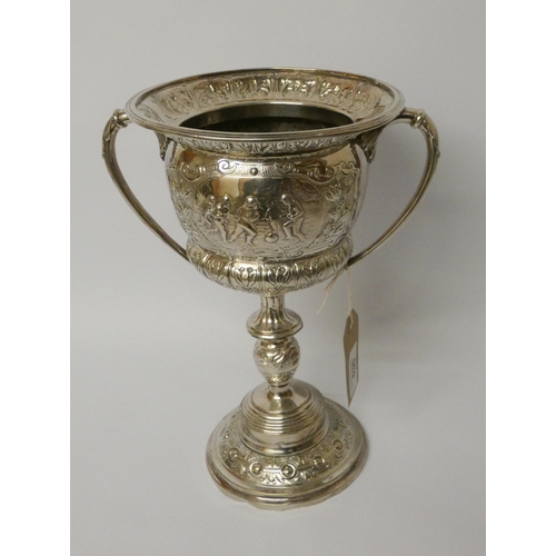 530 - A large silver plated twin handled trophy cup - The Carter Cup. 28cms tall