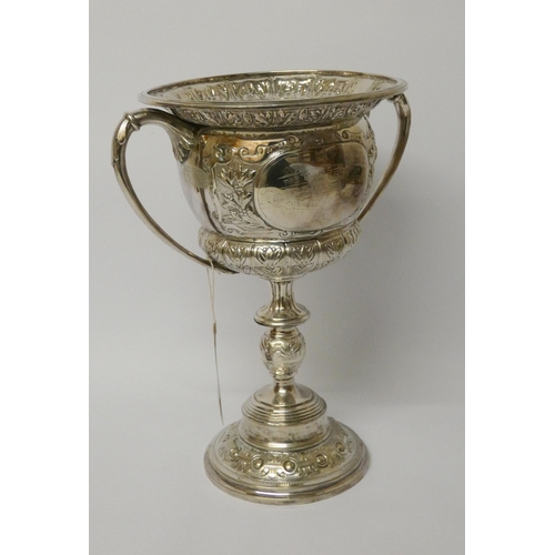 530 - A large silver plated twin handled trophy cup - The Carter Cup. 28cms tall