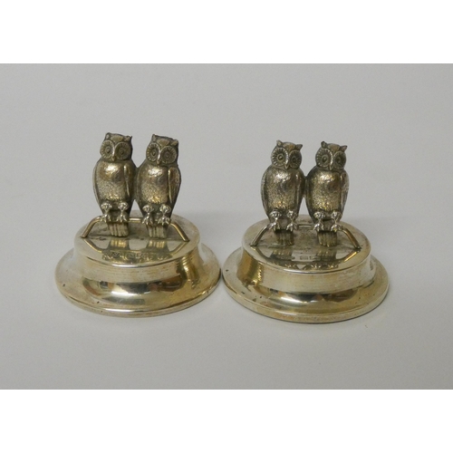 534 - A pair of novelty silver owl menu card holders, by Levi and Salaman, Birmingham 1905, modelled as tw... 