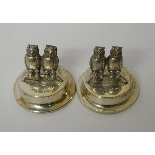 534 - A pair of novelty silver owl menu card holders, by Levi and Salaman, Birmingham 1905, modelled as tw... 