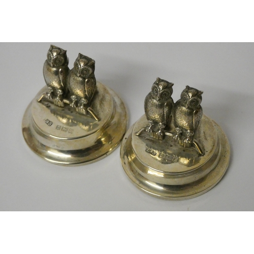 534 - A pair of novelty silver owl menu card holders, by Levi and Salaman, Birmingham 1905, modelled as tw... 