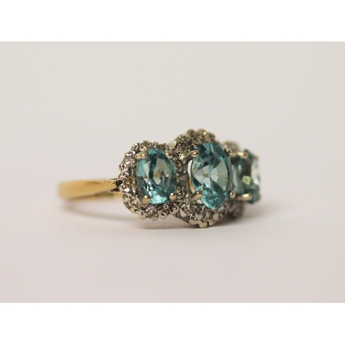 441 - A vintage blue topaz and diamond triple cluster dress ring, on 18ct yellow gold band, ring size P, w... 