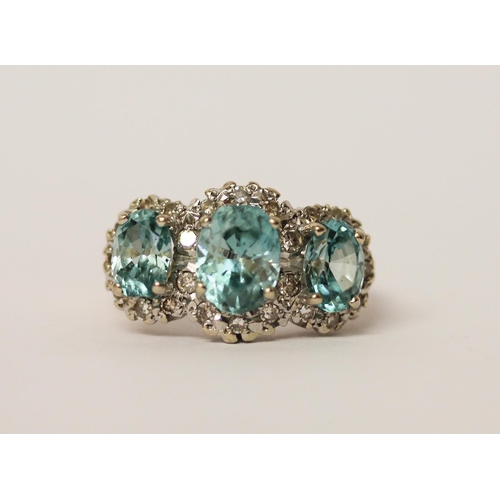 441 - A vintage blue topaz and diamond triple cluster dress ring, on 18ct yellow gold band, ring size P, w... 