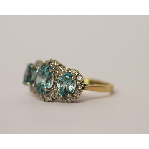 441 - A vintage blue topaz and diamond triple cluster dress ring, on 18ct yellow gold band, ring size P, w... 