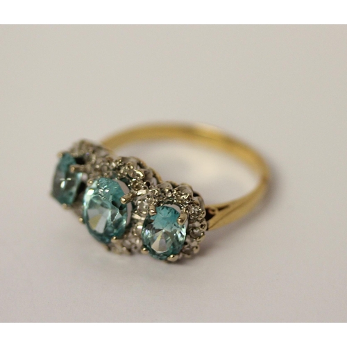 441 - A vintage blue topaz and diamond triple cluster dress ring, on 18ct yellow gold band, ring size P, w... 