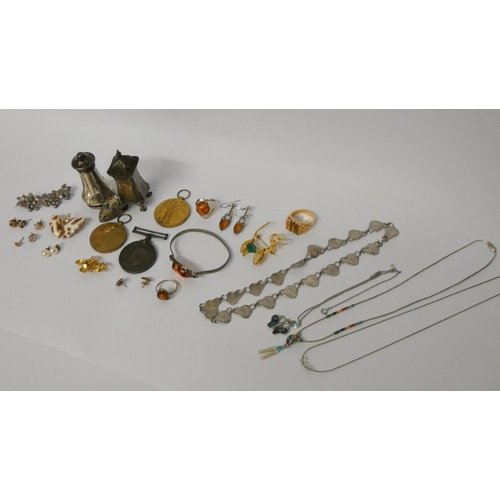 454 - Silver pepper pots, silver and amber jewellery and various other costume jewellery and medals.