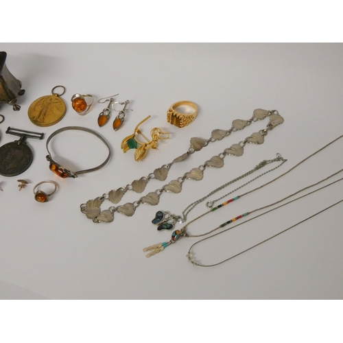 454 - Silver pepper pots, silver and amber jewellery and various other costume jewellery and medals.