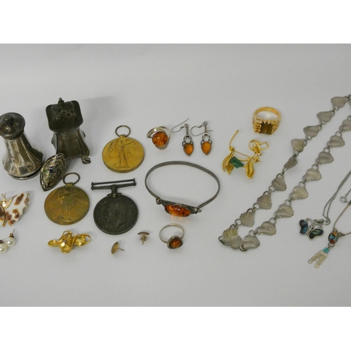 454 - Silver pepper pots, silver and amber jewellery and various other costume jewellery and medals.