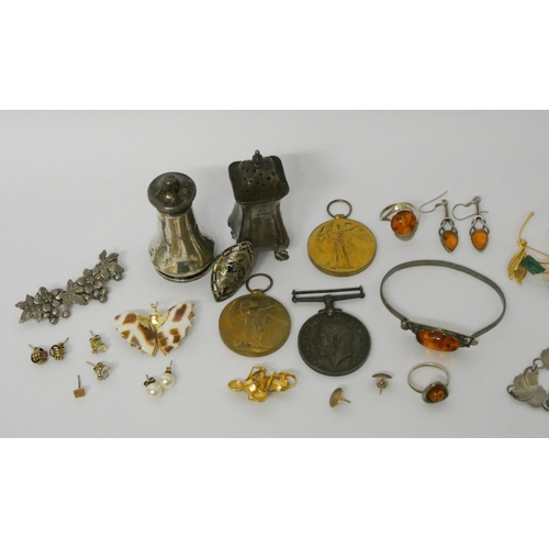 454 - Silver pepper pots, silver and amber jewellery and various other costume jewellery and medals.