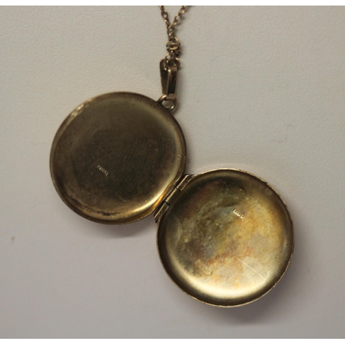 455 - A 9ct circular locket on fine gold chain. 4 grams