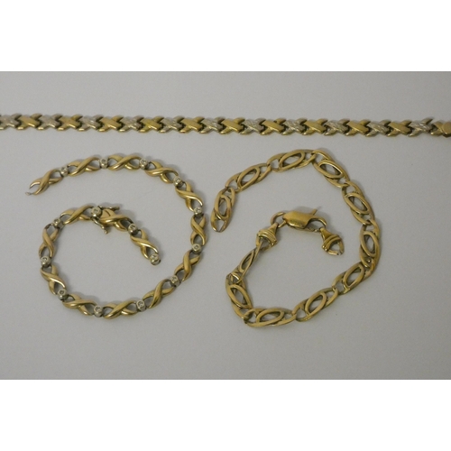 458 - Three 9ct yellow gold bracelets, gross weight 15.7 grams - all three with clasps needing attention