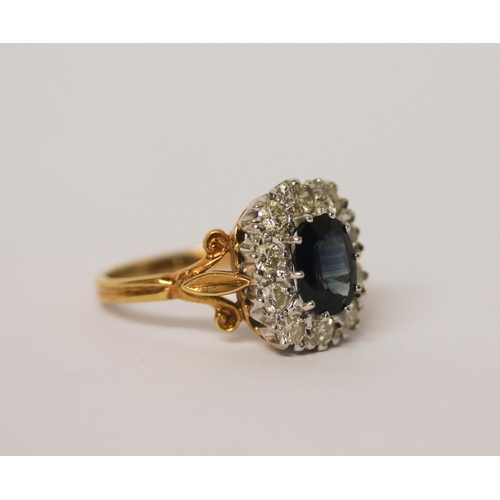 460 - A sapphire and diamond large oval cluster ring, the  mixed cut sapphire surrounded by ten brilliant ... 