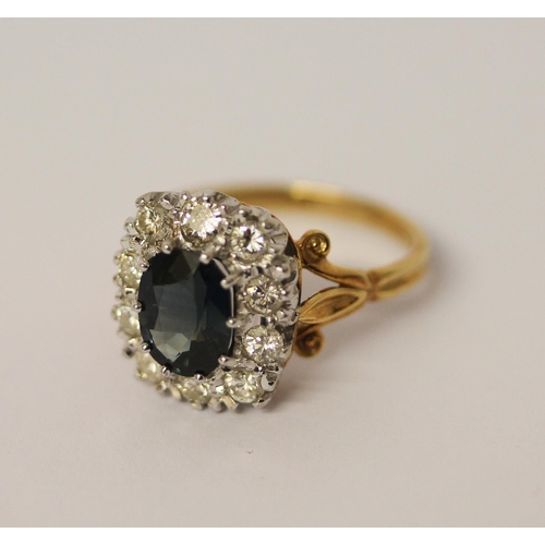 460 - A sapphire and diamond large oval cluster ring, the  mixed cut sapphire surrounded by ten brilliant ... 