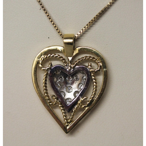 464 - A diamond set heart pendant, the diamonds pave set in yellow and white gold, suspended from a 9ct bo... 