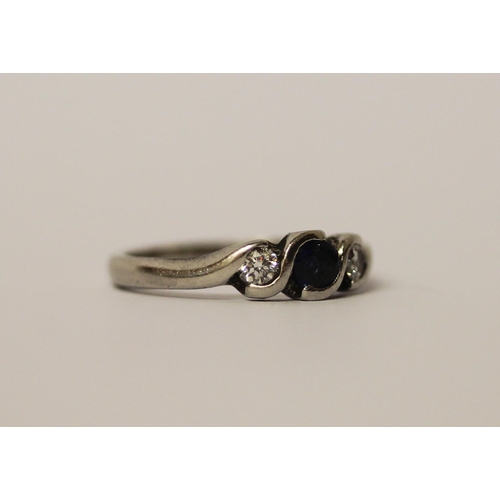 467 - A platinum set sapphire and diamond three stone ring, hallmarked, ring size L 1/2, weight 4.1g