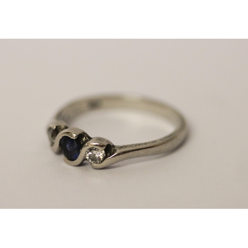 467 - A platinum set sapphire and diamond three stone ring, hallmarked, ring size L 1/2, weight 4.1g