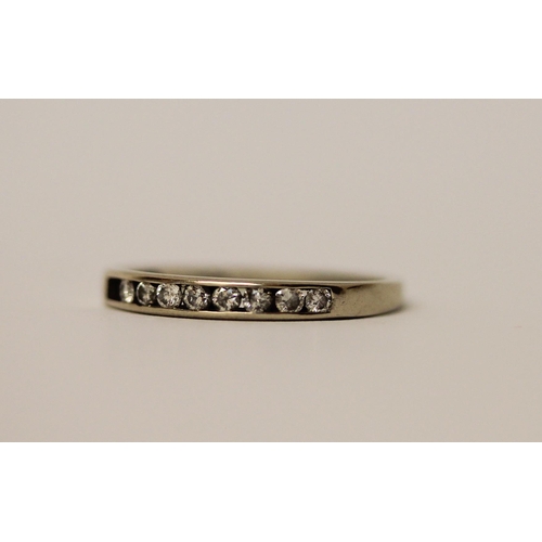 471 - 18ct white gold half hoop eternity ring, set with channel set diamonds. Hallmarked, ring size N. Wei... 