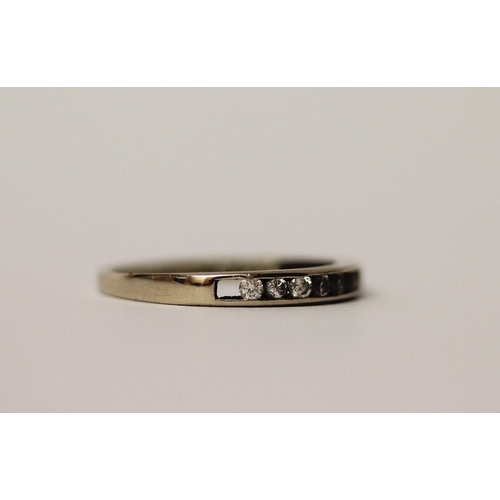 471 - 18ct white gold half hoop eternity ring, set with channel set diamonds. Hallmarked, ring size N. Wei... 