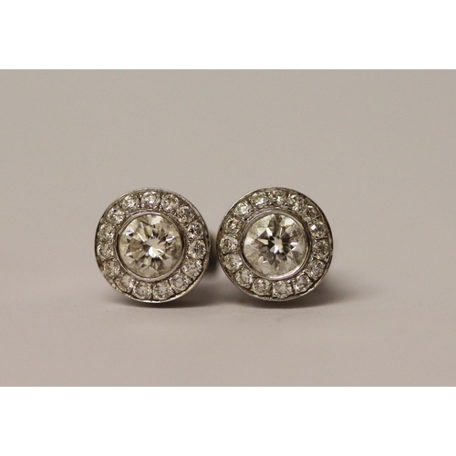 434 - A pair of diamond cluster ear studs on 18ct white gold posts