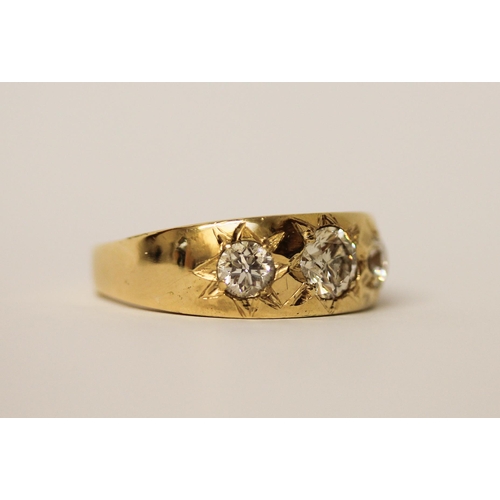 484 - Gents 18ct yellow gold three stone diamond gypsy ring, the central diamond weighing in excess of 1ct... 