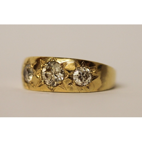 484 - Gents 18ct yellow gold three stone diamond gypsy ring, the central diamond weighing in excess of 1ct... 