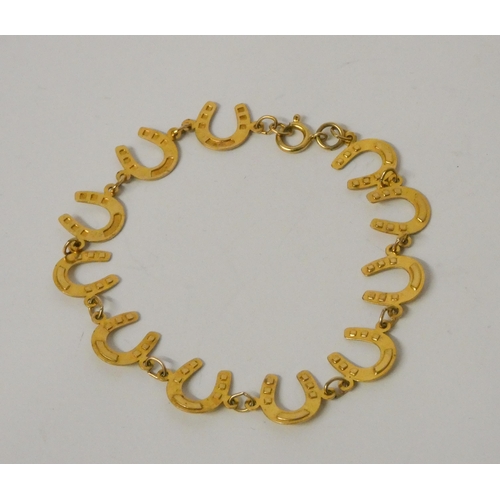 485 - 9ct yellow gold horseshoe motif bracelet, hallmarked, 3.4gms